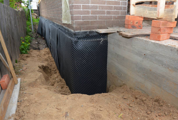 SJ Waterproofing Pros technician performing targeted Basement Waterproofing assessment in Holmdel, NJ